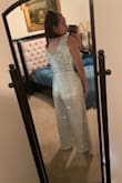 Loved the jumpsuit but I'm gonna have to return. The material was great and the length was perfect (I'm 5'8"). It also fit very my larger chest very well (I'm a 36DDD). The only issue is that the jumpsuit barely gives any room for a torso - it pulls up in the middle and is unflattering for the crotch area. It makes it look like it doesn't fit well in the front, but is unnoticeable in the back. It would work for someone with a shorter torso but everything else fit perfectly. I wish it worked. - Madelyn D.