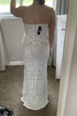 This dress fits like a glove - no need for alterations! It looks more expensive in person. Pictures do not do this dress justice!! I am going to wear 2-3" heels to compensate for the length. It's going to match my ivory veil perfectly - I am in love! - Yvonna W.
