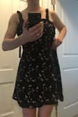 The fabric, color, and pattern are a perfect match for the pictures online. Truly adorable! Unfortunately, this dress runs very big. I am a medium in skater dresses 99.9% of the time... too bad this is the .1%. The chest, waist, and straps are all too big. Size down! - Kayla H.
