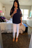 Based on other reviews I decided to go up in size to a medium. I think a small would have been fine too, but was concerned about length. The fit of this shirt loose. If between sizes I would pick based on what's most important (ex: if wanting it to be longer go up in size, if you have a smaller frame/bust choose the smaller size, etc.). I am tempted to buy this in other colors because I like it so much! - Alexia K.