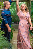 Is absolutely love this dress! I wore it for my engagement pictures! The neck line does plunge some and is a little uncomfortable because I don't want to show off my girls! I plan on getting it fixed so it's not as revealing! - Lydia L.