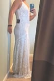 Great quality, beautiful fabric. Exactly what I expected. But I'm 5'4" and tried it on with 4 inch heels and it still needs 2-3 inches of alterations. I was sad to return it but my schedule did not allow alteration times. It wasn't the most flattering from the front because I'm a bit boxy but I still loved it. Wish Lulus has petite or short options for their dresses! - Allie L.