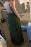 I was looking for an olive green dress for an outdoor wedding I am in this August in TN (aka going to be very hot). After reading reviews, I went out on a limb and ordered this dress. While the color is much darker in person than the picture, I am pleased with it. It fits me well and will definitely help me to stay cool in the southern heat. I am relatively tall at 5'7" so dress length is always a concern for me with long dresses, and I will comfortably be able to wear a 2-3" heel with this dress! I also have an average bust, so the chest is not too snug, too loose, or too low cut which is often a concern with backless dresses like this one. Good quality at an affordable price! - Hailey S.