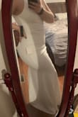 COVID-19 is potentially messing with our wedding plans - I bought this dress to either wear for rehearsal dinner if everything goes to plan, or for my "wedding dress" if we have to have a COVID ceremony. It fits like a glove! It's so comfortable and beautifully lined. It has stretch to it which is perfect for curves, but the material feels really high quality and sumptuous. I didn't want to take it off! I also love the adjustable straps so I can make the top fit just right. I'll need to hem it a few inches, but other than that it's perfect. Whichever way situation goes, I'm excited to wear this dress! (In the pictures I'm wearing one pair of regular Spanx and no bra, for reference). - Alexandria C.