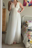 I decided to size down to a medium and I'm so happy I did! It's a bit tight around but it definitely fits my chest size. Any bigger and there's a possible slip. Great length, especially in heels! Wearing this as a bridesmaid dress and I'm very excited!! - Samantha A.