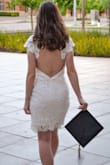 I ordered this dress for graduation, and it did not disappoint! Nice material and well made. The zipper gets caught occasionally and it is a little bit in the back (because I have a small chest), but otherwise fit perfectly! - Jennifer T.