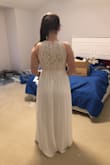 I ordered three dresses to try on at home for my elopement next month. This dress is much more flattering on than it is pictured online. It is much more nude under the lace than pictured online, but SO pretty. I am used to dresses meant to be floor length being way too short on me and I can say that definitely is not the case and if I was keeping it, I probably would've hemmed a little bit. Four starts bc it wasn't the winner. - Shelley C.
