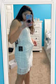 This is the third dress that I have gotten from lulus and returned that was super tight on my thighs but left a big pouch on my waist. I have A curvy body but this dress hides my shape It's super pretty I wish It fit well to compliment my body. - Mary A.
