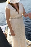 I was having a small wedding and needed a perfect dress that wasn't too casual (we all want to feel like a bride!) this dress was perfect. I originally was getting married on the beach but due to the Covid-19 outbreak we changed our location to be closer to home and on a lake. The dress was perfect, very comfortable to wear and not too heavy. I added some wedges to give me some height and the dress still touched the ground (but not so long that I tripped). The material did catch some of the leaves/moss on the ground but no real complaints. It is a little see through near the knees (you could see shadows) but I wore spanx underneath and you couldn't tell! I'm so glad I chose this dress for my wedding day! I purchased the belt from amazon (Chose it based on reviews!) and it added just the right amount of bridal to my look. - Laura G.