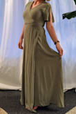 This dress is lovely. It's not too thin to show through, is cool enough for summer, drapes well, and can be situated to cover my moderately sized chest without wearing something underneath! I dress rather conservatively. The material is slightly more casual (and darker) than I saw on the model and as other reviews stated it does wrinkle very easily. The medium size wasn't quite as drapey on me as on the model, but not tight enough to return it. It does shrink if you put it through the dryer! Mine shrunk by about 10 inches! But it easily reverses with a conditioner treatment. It was about 4 inches longer than I wanted so I partially dried it until it was my perfect length. No hemming necessary! - Kaily C.