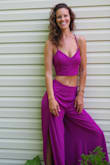 This power purple pant suit is a killer. The color pops and is so bright you'll turn heads wherever you go! The leg slits are fantastic for keeping you cool or adding flare to dancing, and the back is my favorite little detail. For someone with a smaller bust, this top has magic skills to make them appear, even without a bra. With a long torso, the gap between the two pieces is somewhat larger, but is a friendly encouragement to work on and show off my abs. - Becky C.