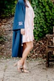 I bought this for my graduation, which unfortunately got canceled. However, I still got some use out of the dress by taking grad pics! It's gorgeous, and complements my skin tone along with my cap and gown. It is a bit of a lighter pink than posted in the picture. - Joan K.