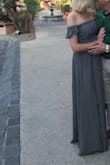I thoroughly enjoyed wearing this dress! The material is light and the slit is high. My legs are long however I found the dress ran on the long side even with 2.25" heels. Looking forward to another opportunity to wear this again. - Julie D.