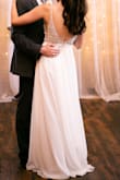 I ordered this dress for my elopement. I couldn't wear my original wedding dress since my bridal boutique was closed but this dress worked perfectly and was beautiful. I have no regrets at all about this dress. I am usually a size 4 so I was surprised the 2 fit so perfectly. The waistline of the dress where the sparkles start is not a stretchy material so you do want to get your sizing right so the waistline is as flattering as possible. - Riley N.