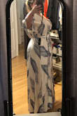Loose and great cut for hiding problem areas. Going to wear it for my bridal shower :) I am wearing wedges in the photo because I am NOT tall. - Jamie D.