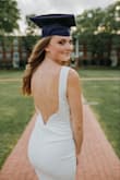 I absolutely loved this dress. The material was perfect and fit so nicely. The back is so sexy and the front is very appropriate and professional. It is long enough to be professional as well. Goes great with nude heels and small jewelry assets. Loved loved loved it!!!!! - Kelsey T.