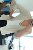 The material is thin and the color and quality are great. Looks and feels like linen. It's a looser type of blazer (which I like because it's comfy). - Faustine D.