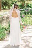 I absolutely love this dress!! It was perfect right out of the package for my height and arm length. The back lace detail is stunning and the fabric quality is impressive! I wore this for my elopement and received so many compliments! - Caroline K.
