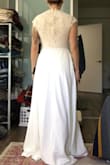 I was surprised by how heavy this dress was, great material, but far too much material for me. The lace is very pretty and the cap sleeves and neckline is a very elegant touch, but too frilly for me, ha. I tucked them in, making a more modern look. - Allison B.