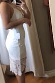 I'm 5'0 and about 100 lbs. The dress is definitely tight fitting, but is flattering! I ordered the size small as well, but it was a pretty big difference in sizing, so I stuck with the XS. It was somewhat difficult to sit in, but after trying it on multiple times, I think the material starts to become more fitting. - Anna M.