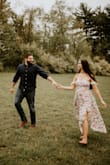 I wore this dress for my engagement photos while I was 20 weeks pregnant! It hid the bump very well and was SO pretty! The fit was perfect and was loose fitting around the waist area! Definitely would look good if you were trying to show off the baby bump too! - Kaitlyn K.