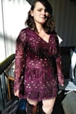 I bought an XL. I bought this dress for a 20's party my work was having in Jan. 2020. This dress held up very strong and was so comfortable to wear. I was afraid it would be too form fitting but it laid perfectly on me! Hid my gut and I didn't feel self conscious AT ALL. Which was my biggest fear. My only critiques are that the sequins fall off just walking around and the V neck was slightly off leaning more towards one side than down the middle. Other than that I loved this dress so very much and I can't wait to have a reason to wear it again. The fringe was fun to shake around when I was dancing! - Michaela S.