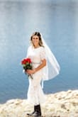 I wore this dress for my Colorado Elopement to Twin Lakes. I wanted to wear something that showed off my vintage cowboy boots. The lace was so elegant and it hugged in all the right places. I glued in bra pads so I didn't have to wear a bra and added a belt to spruce it up I got off Amazon. For under $100 you can't beat it! - Libby P.