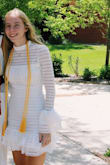 I wore this dress for my high school graduation because it's a tradition to wear white. It was really flattering and the stretchy material fits you like a glove! It is a unique design that is very feminine and cute! - Libby L.