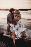 This dress, the fabric, the print, everything about it is beautiful. I wore it for our engagement shoot and got SO many compliments! My only complaint is the bust part running small, or maybe the button was just weak because the slightest movement the button would come undone. or maybe because I am six weeks postpartum and haven't shed all of my baby weight yet. I probably couldve gone up a size, but then I would've been the dress altered because it does run a little long. My fiancé's grandma had to change the button at the bust and add another one at the waist to keep it coming from undone. Other than that, the dress is overall beautiful. - Shannon F.