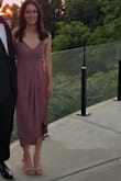 Wore this dress to an outdoor wedding and it was perfect for the occasion! I ordered an XS (a size smaller than my usual) after reading other reviews, and found that it was a little tight in the bust area. I would say to order a size smaller if you plan to wear it without a bra, and order your usual size if you plan to wear it with a bra. The slit on the dress also runs all the way up, so it can be revealing if you're not careful. Overall it was a very flattering dress though. - Rebecca J.