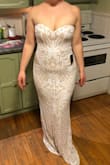 I bought a few dresses, the other ones were great, but thick material. This one was very nice, soft, shimmery and medium thickness. I will need to wear spanx to smooth out my stomach. The clasp is hard to close, its a longer shape than normal, I had to get help to do up the dress. But when fastened it was very comfy, I would rather tight then falling down. I am not wearing shoes in the picture, so i have about two inches to work with, when it comes to heal size. I feel like a mermaid in this dress, it's absolutely beautiful and would recommend to anyone. - Siobhan G.