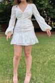 I'm perpetually between sizes because I am very pear shaped, but I decided to order a Small to ensure it fit on top. It was a little tight in the hips but still fit pretty well! I wore this for graduation photos and it looked perfect! The dress is just as pictured. It's not super breathable material for a hot day, but too cute and so pretty. - Salma C.