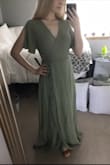 I ordered this dress for my engagement shoot. I read all the reviews for this dress, which said it came wrinkled, was too long, and the tie was hard to figure out. It did come wrinkly, but nothing that a steamer can't fix! The dress is too long; I'm 5'2" and wearing 2" heels in the pictures. This dress is made for a 5'7" person, so if you're short like me, you definitely need to make plans to get it hemmed (or wear super tall heels). The tie was not difficult to figure out since I've worn wrap-style dresses before. The fabric is very soft and very flowy, and it is not see-through at all. My bust is a 32D so if your bust is any smaller and you're under 5'4", I suggest ordering an XS otherwise you'll be swimming in it. If you're short and a 32DD, I suggest ordering a M since it will show lots of cleavage (still plan on getting it hemmed). Overall, I'm ECSTATIC to take pictures with my fiancé in this!! Thank you Lulus! - Morgan S.