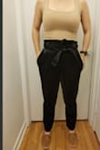 The inner seam of the pants is incredibly itchy. I was uncomfortable as soon as I put them on. I don't know if wearing tights underneath the pants would stop the seam from scratching my thighs but I might give it a try. If not, I don't think I will be able to wear them. There are loose black strings coming from the seams as well (top of the pocket, the pleats in the front, the end of the tie). The size guide told me to order M, and they were quite big. I also ordered the green pants in an S and they fit more to my liking. Maybe it's just my preference. If you're between sizes I would recommend going for the smaller option. - Aran O.