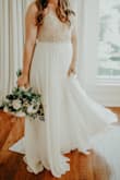 I wore this at my elopement in May and it was perfect! We had to postpone our wedding due to COVID, but still wanted to get married, so I had to find an elopement dress pretty quickly. This one somehow fit like a glove without any tailoring. It was definitely long on me, but not so long that it was an issue. Definitely recommend this for an elopement/bridal luncheon/rehearsal/literally anything else! - Sarah M.