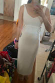 I'm in love with this dress. It's a good amount of modest and classy with the longer cut and with a little surprise with the side cut outs. It is quite form fitting so I would probably use some spanks when I wear it out. Other than that, can't wait to go out in this cute number. - Florizza R.