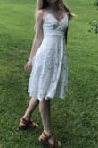 I wore this for my high school graduation, and it fit great! I had no problems with the fit or the material. If you wear dark colored spandex, it is a bit see-through but that's easy to avoid. I would definitely recommend this to a friend! :) - Kate K.