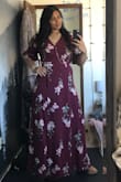 I think this dress is beautiful! The fabric does not stretch much making it important to order true to size. I'm normally a size medium/large and I ordered an XL because I have a large bust, broad shoulders and very muscular arms. The dress is a little tight in the arms, but it still fits and is easy to adjust as it's a wrap dress. The fabric is a heavier weight and a little thicker so it's not see-through. The only things I really don't like about the dress are: 1) It's a wrap dress, so when the wind blows, or when I sit down, the panels in front spread wide apart showing all of my leg. I fixed that problem by buying a matching slip to wear under the dress. 2) It's small in the bust. The clasp on the bust does not stay closed and pulls apart when I move my arms. So, for occasions when I want to be more modest and cover up my bust, I have a full-length slip I can wear under the dress. Otherwise, this dress has a deep V in front that shows cleavage if you have it. - Abigail O.
