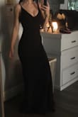 I love this dress! The material is nice and thick without feeling too heavy. The straps are adjustable which is amazing! The back comes down just far enough to cover a bra if needed. - Laynee A.