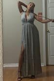 The fabric is soft and flows. The top is adjustable, the dress is beautiful. You can dress up or down, but very good quality. Shilling went smooth - Zella H.