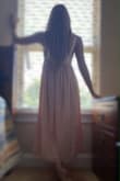 I absolutely love this dress and received so many compliments on it. That being said, beware of the straps, I'm 5'4" and ordered an XS. I had to shorten the straps by about 4" to make sure I was covered fully. Other than that it's a beautiful dress. - Jolee B.