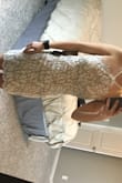 With the nude color of the dress, it didn't look right on my skin tone. I loved the back and it fit nice and tight. Just didn't love the way the front looked on me. - Sydney W.
