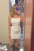 I bought a small and this dress fits really well! My only complaints are the arms are a touch tight, but I also don't have dainty arms. The other thing is the mesh on bottom is really weird. Looks good from the front but the back isn't quite right. I cut the bottom mesh off (with just a pair of kitchen scissors) like one of the other photos and love the dress. Plan to wear for my bachelorette party! - Brittany H.