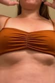 I am a 35 year old 5' 135lb mother of three. I needed a sexy yet covering swimsuit. This hit the spot for me and my husband! My daughters have been mistaken for my sisters since I bought this top! The rust color is so grown up, the design of the top is so comfy! Thanks, Lulus. P.S. my oldest daughters nickname is Lulu, which is why I chose the swimsuit! - Crista C.