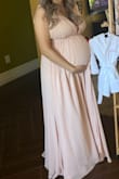 I ordered the dress in a large because I didn't know how big I was going to be for my baby shower, so I was in between getting a medium and large. Thankfully the dress fit nicely!! It zipped up perfectly. The only thing I did have to safety pin/sew, was the bust area. Nothing too drastic, but I didn't want my bust accidentally spilling out of the dress! lol, overall it was a super cute dress!! I would really recommend it. - Sandy D.