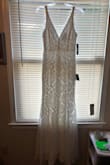 When I saw this dress without many reviews, I was really skeptical. But I took a chance because I just loved it & I was right! Such a nice dress! I don't have a great figure and this dress didn't really hug me tight so I liked that. It's really lightweight and I love it. - Sydnei V.