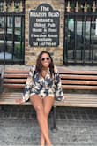 Very flattering and not a tight romper. I love the sleeves. - Marquita F.