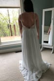 This dress was the bomb! I ordered it for a small elopement since my big wedding got pushed back. I did have to have a few things altered from being a typical petite size- which is normal for me. I had around 5-7 inches hemmed off and left some for a train and bustle. I had to have the straps shortened to stop the back from gapping, and I had bigger cups added because the ones in are for a smaller chested person. Honestly, if you have any sewing skills you could do it yourself. - Emily M.