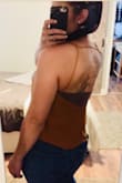 Color is fantastic and I love it! BUT, I wanted it to tuck and drape like the photo in the ad, but it's just a little too short for my torso. It will only do it in a super high waisted jean. And I wish the straps were longer so it would hang lower in the front. It hangs in the back like the photo. - Alexis C.