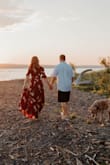 This is such a beautiful dress! I ordered this dress for our engagement pictures. I got an XS which was very long for me, but I am on the smaller side. I had this dress hemmed and ended up wearing 3" heels with it so it just grazed the ground. It is a wrap dress which is great so you can tighten/loosen it as needed. I ended up using a safety pin on the chest of the dress. There is a little clasp closure, but it was a little too low for my liking. Overall, very pretty flowy dress! 10/10 - Alicia P.